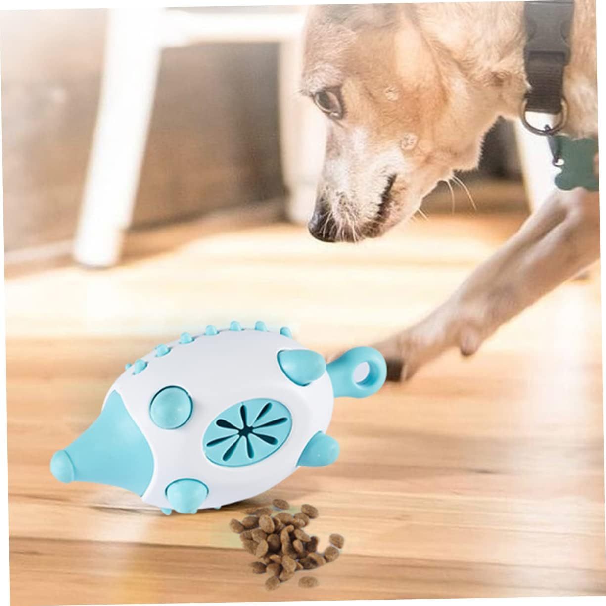 Dog playing with the blue HedgeBite dog toy, dropping food from the toy as it chews, showcasing interactive mealtime fun and enrichment.