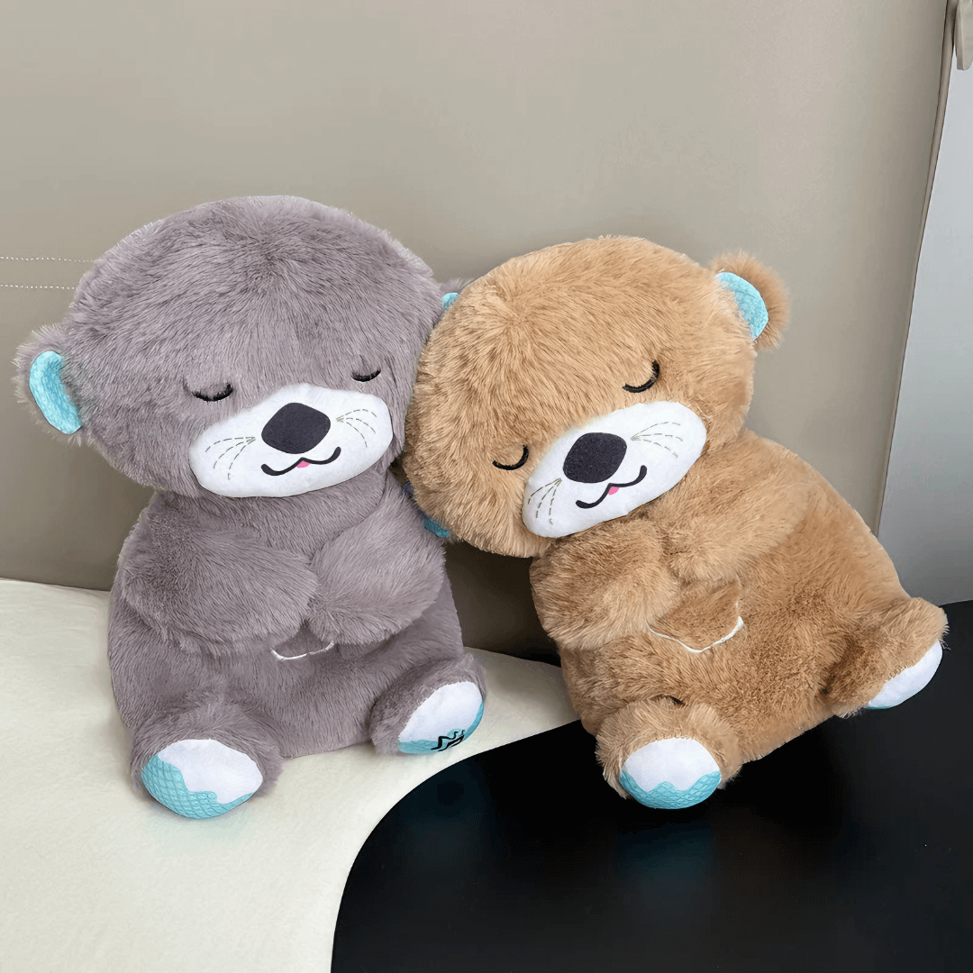 Front view of two Calming Otter dog toys in brown and grey, with the brown otter leaning on the grey one, designed for dog separation anxiety relief.