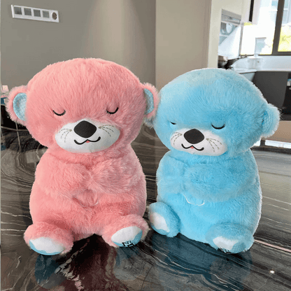 Front view of two Calming Otter dog toys, one pink and one blue, angled at 15 degrees towards each other on a table, for dog separation anxiety relief.