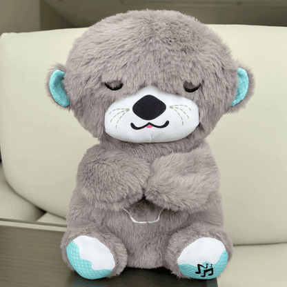 Front view of a grey Calming Otter dog toy, designed to help alleviate dog separation anxiety with soothing comfort.