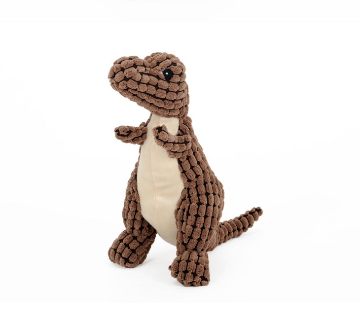 Side angle of the brown Jurassic Chew dinosaur dog toy, highlighting its plush corn velvet outer layer and sturdy PP cotton stuffing. White background.