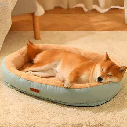 Side angle of a light green Anxiety-Free Dog Bed with a dog resting comfortably, designed to relieve separation anxiety and provide calming comfort.