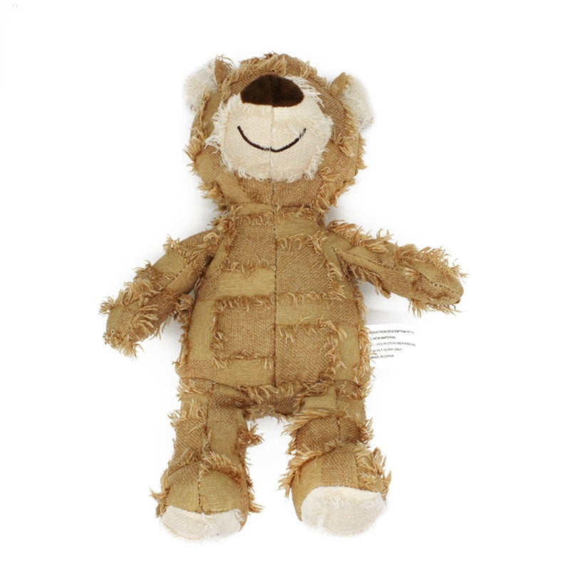 Beige Toughy Bear plush toy viewed from a lower angle, showcasing its soft, durable texture against a white background.