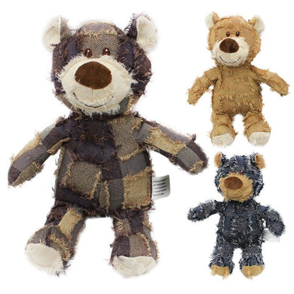 Brown Toughy Bear plush toy on the left, detailed and large, with two smaller versions of the blue and beige Toughy Bear toys on the right.